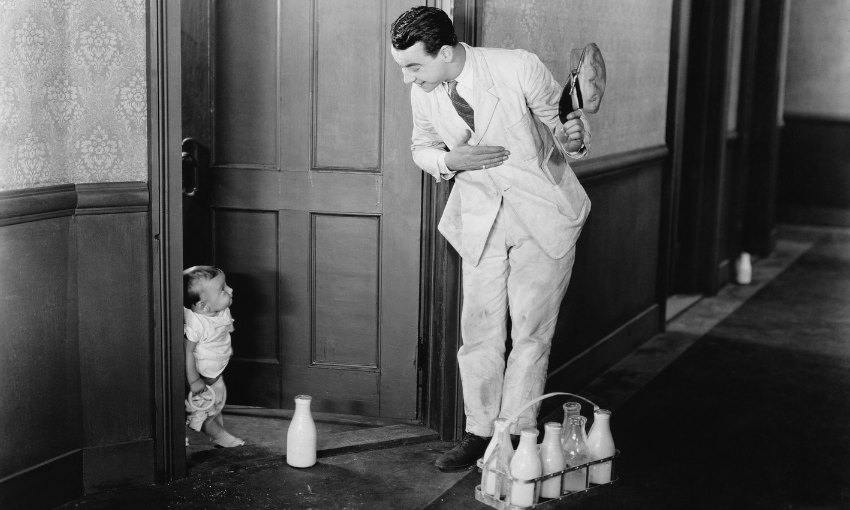 1950s-Milkman-Delivering-Milk-To-Door