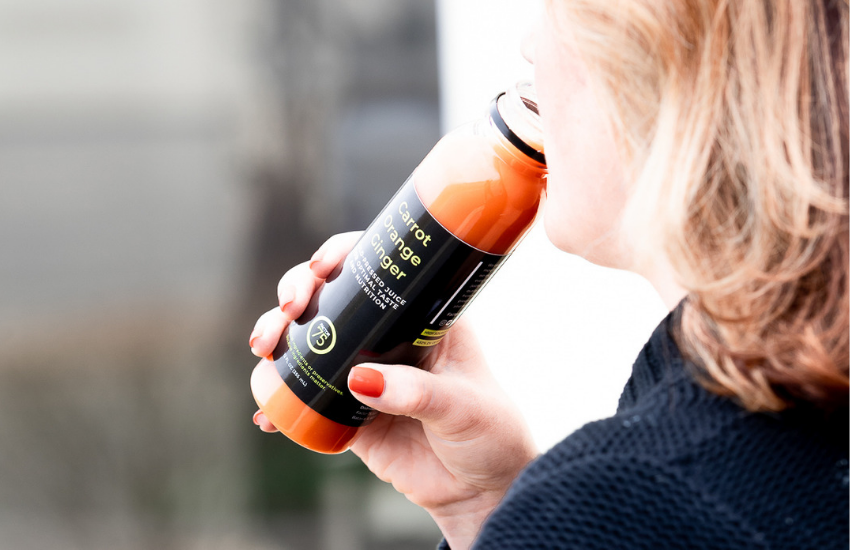 WOMAN-DRINKING-FACTOR-75-COLD-PRESSED-JUICE
